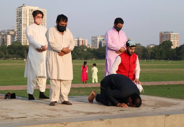 Offering the Eid Namaz.