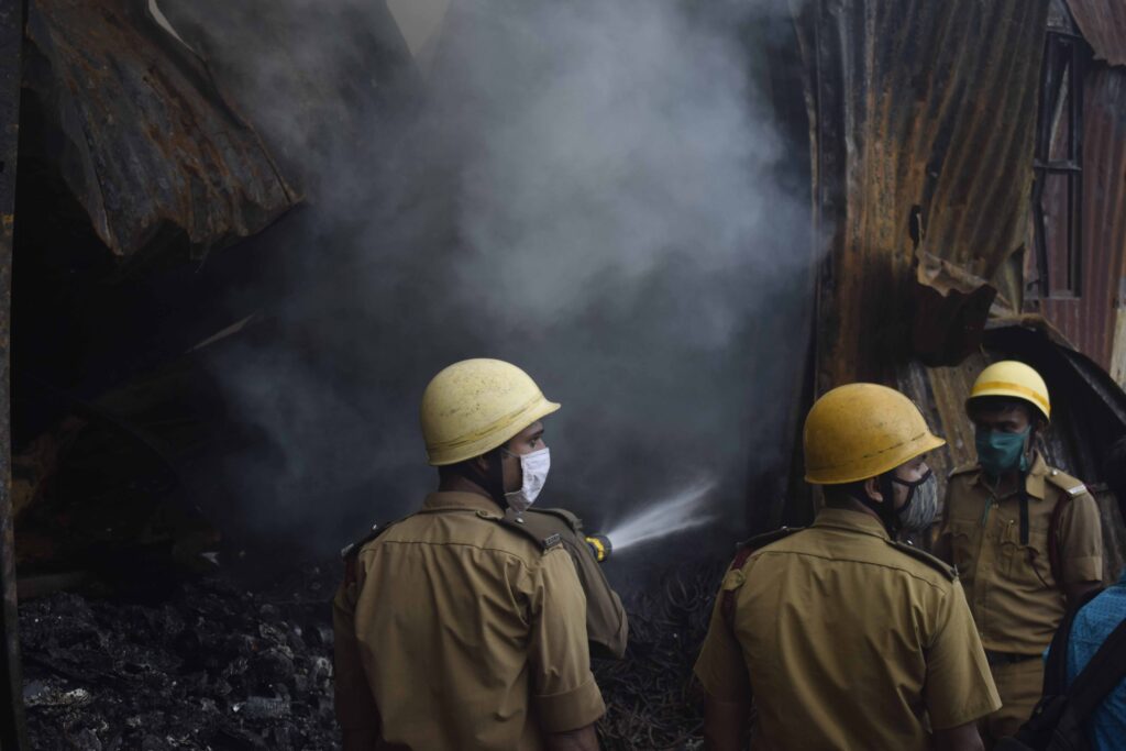 Firefighters at work - Garden Reach FCI Warehouse in Kolkata, West Bengal, India.  Photo by Sabyasachi Bandyopadhyay, September 11, 2021.