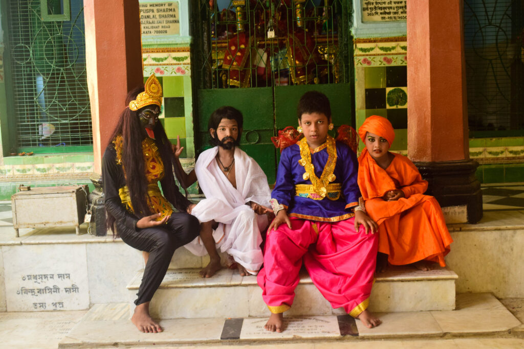 Children dressed as Bohurupis during Gajan festival at Kalighat Potuapara Sitala Mandir