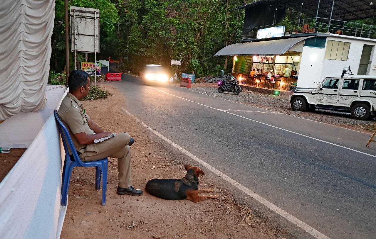 Kerala police security personnel vigilantly monitors vehicle movement at manimoola check post point in Kasaragod district of Kerala ahead of the upcoming parliament election in Kerala. Hundreds of such election squads have been working across the state to maintain strict surveillance to prevent illegal cash and liquor inflow during this crucial electoral period. Photo by: Satheeshan K