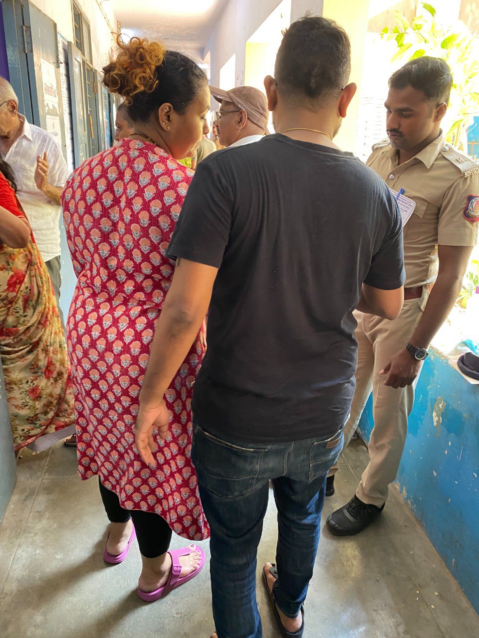 Police Guide: Police Man guiding the voters inside the polling booth at ELM Fabricius Higher Secondary School in Chennai. Photo: S Vishnu Sharmaa