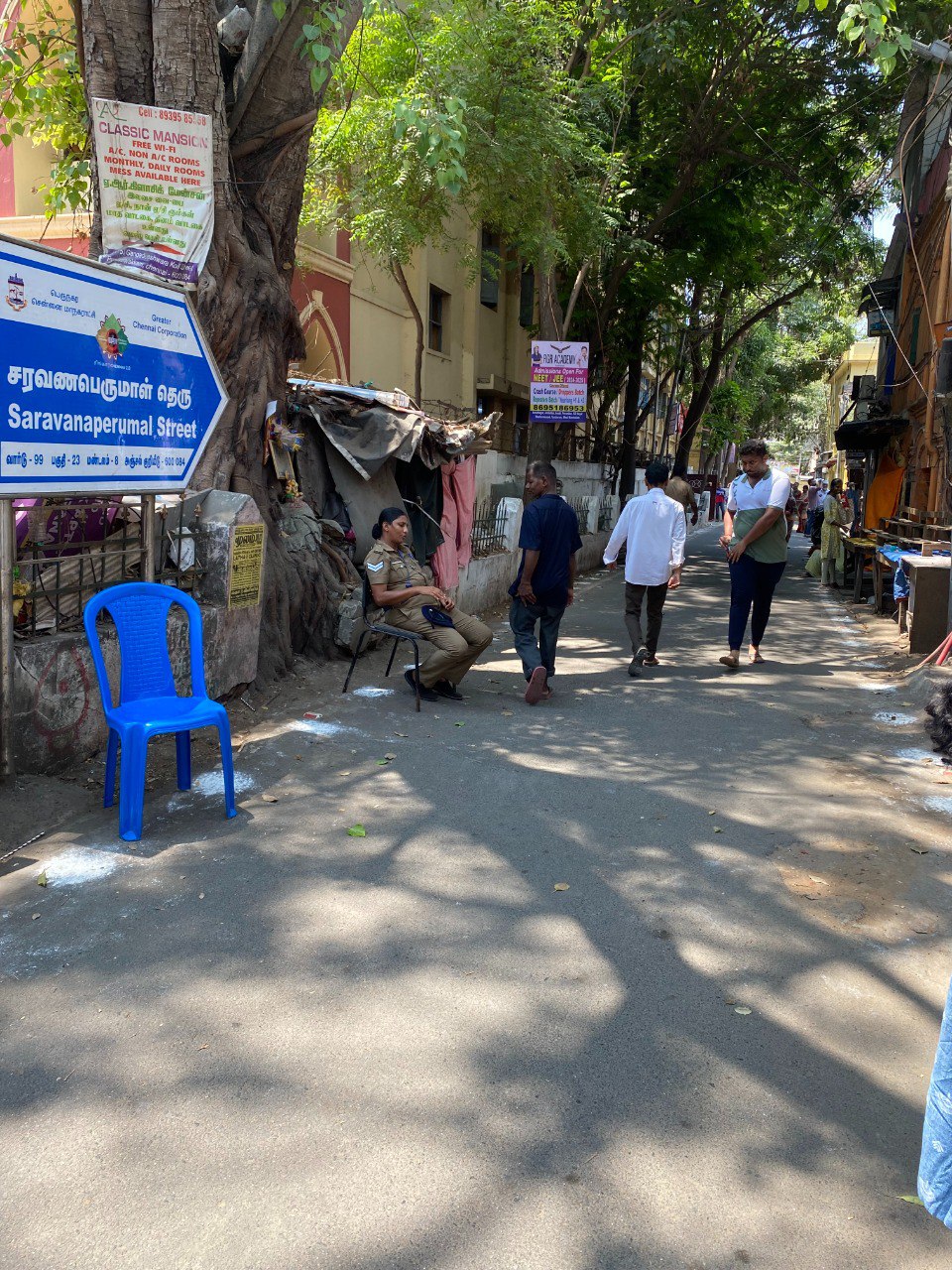 Police Guide: Police woman guiding the voters towards the polling booth at ELM Fabricius Higher Secondary School in Chennai. Photo: S Vishnu Sharmaa