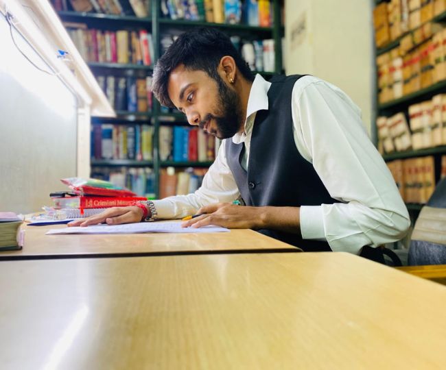Advocate Arunim Kathuria working at his desk